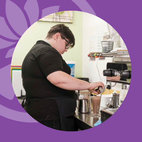 Woman who works at Lily and Lime making a hot chocolate.